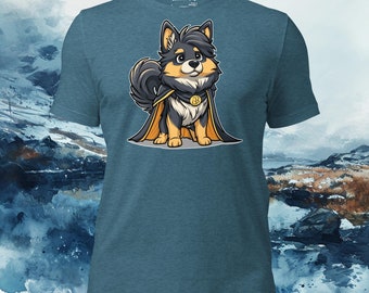 May include: Teal t-shirt with a cartoon dog superhero wearing a black and gold cape and a Bitcoin emblem. The dog has black, tan, and white fur. The shirt has the text "Lapphund Designs" at the top.