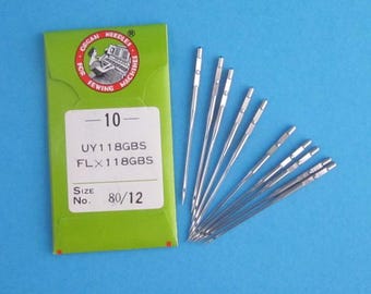 Puede incluir: Un paquete de 10 agujas de máquina de coser plateadas, tamaño 80/12, etiquetadas "UY 1 18GBS FLX 1 18GBS" y "Organ Needles for Sewing Machines".