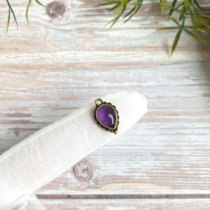 Small drop-shaped brass pendant with gemstone, charm with two eyelets for macrame