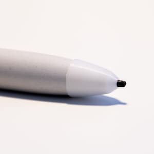 May include: A white stylus with a black tip, designed for use with a tablet or touchscreen device.
