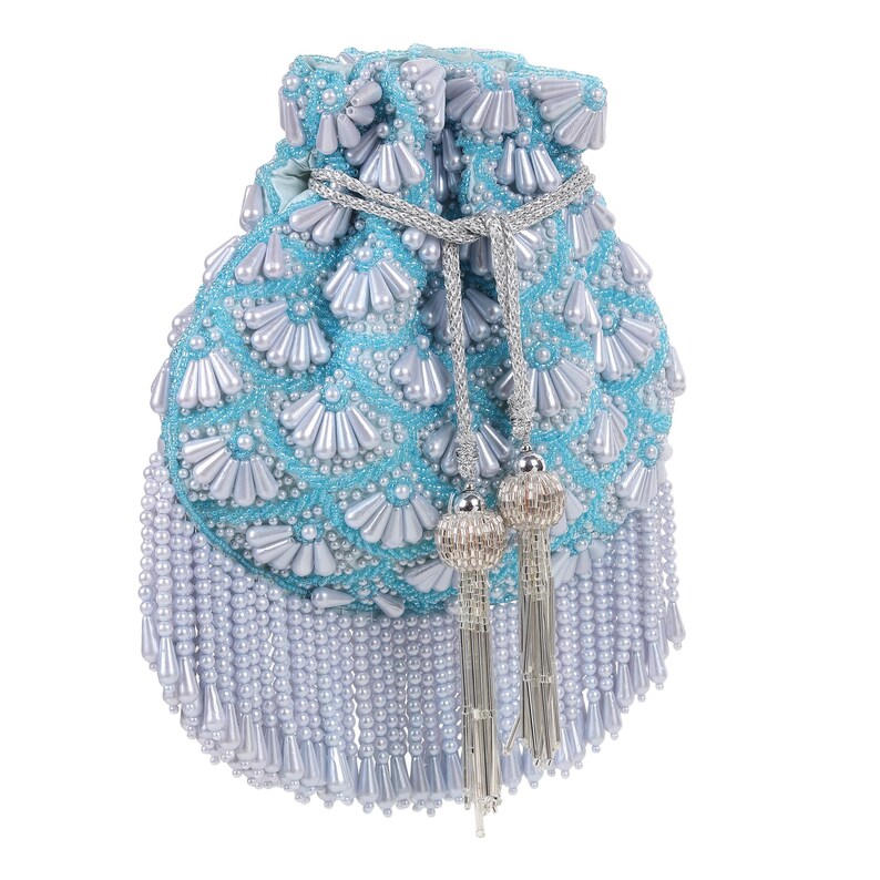May include: A light blue beaded pouch with a drawstring closure and silver tassels. The pouch is covered in white fan-shaped beads and smaller round beads. The bottom of the pouch has a fringe of white beads.