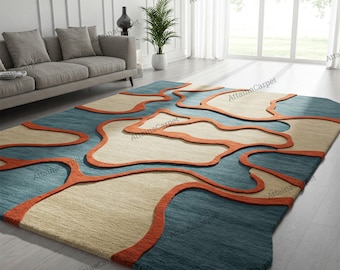 Alfombra de lana tejida a mano en azul turquesa y beige, moderna y abstracta para sala de estar.