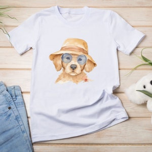 May include: White t-shirt with a watercolor illustration of a golden retriever puppy wearing sunglasses and a straw hat.