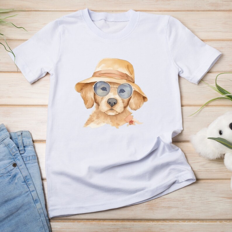 May include: White t-shirt with a watercolor illustration of a golden retriever puppy wearing sunglasses and a straw hat.