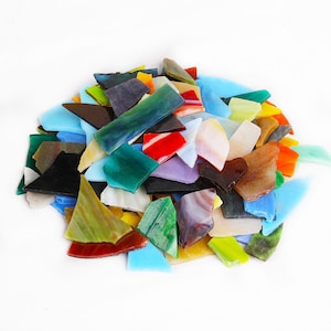 May include: A pile of colorful glass pieces, perfect for mosaic art projects. The pieces are various shapes and sizes, with shades of blue, green, red, yellow, and purple.