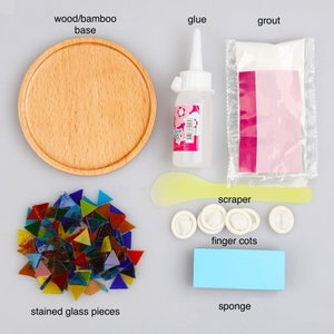 May include: A stained glass mosaic kit with all the supplies needed to create a beautiful mosaic. The kit includes a wooden base, stained glass pieces, glue, grout, a scraper, finger cots, and a sponge.
