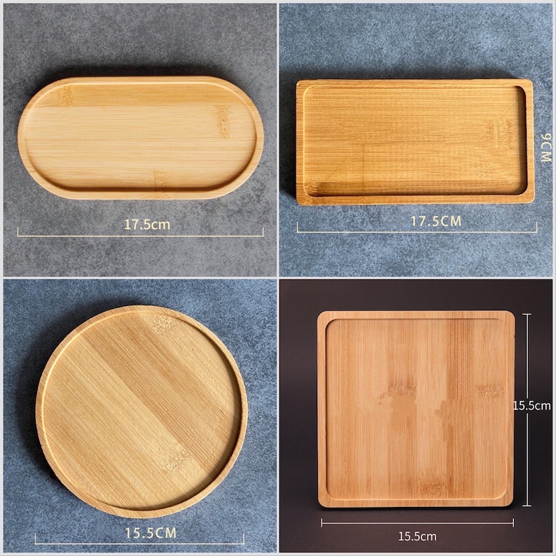 May include: Four wooden trays in different sizes and shapes. The trays are made of natural bamboo and have a light brown color. The trays measure 17.5 inches by 17.5 inches, 15.5 inches by 15.5 inches, and 15.5 inches by 17.5 inches.