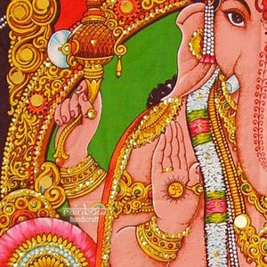 Lord Ganesha holds as an axe or goad weapon and other hand shows Om symbol.