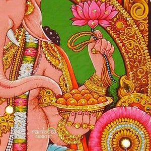 God ganesha holds lotus in one hand and a bowl of sweets, which he eats with his trunk