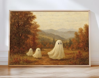May include: A framed print featuring three white ghost figures in a serene autumn landscape. The artwork has a vintage aesthetic, with warm tones of brown, orange, and yellow. The ghosts have black oval eyes, and the background includes trees, mountains, and a church.