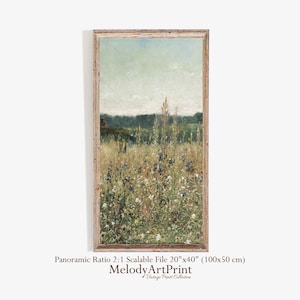 May include: A vintage art print of a field of wildflowers in shades of blue, white, and yellow. The print is framed in a light wood frame and has a panoramic ratio of 2:1. The print is 20 inches by 40 inches (100 cm by 50 cm).