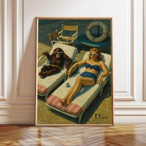 May include: Framed art print featuring a vintage-style illustration of a monkey and a woman relaxing on lounge chairs by a pool. The monkey wears sunglasses, and the woman is in a blue bikini. The word "Dior" is printed in the bottom right corner.