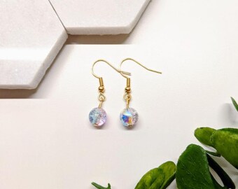 aretes bola de cristal rosa