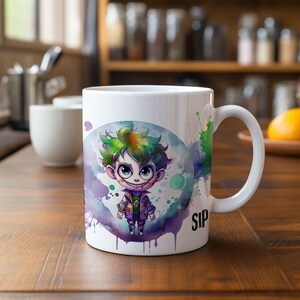 May include: White ceramic mug with a colorful watercolor design of a cartoon Joker character in a purple jacket and green hair. The mug has a handle and the word "SIP" printed on the bottom right side.