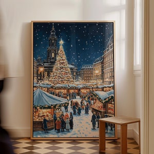 May include: A framed painting of a winter scene with a large Christmas tree in a town square. The tree is decorated with lights and ornaments. There are people walking around the square, and there are buildings in the background.