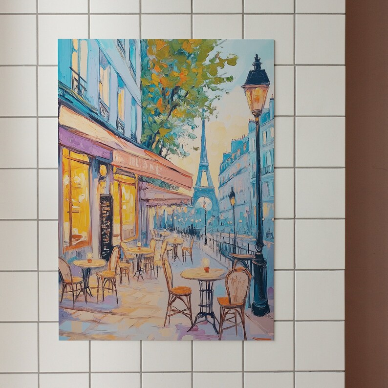 May include: A painting of a Parisian cafe with tables and chairs set up outside. The Eiffel Tower is visible in the background. The cafe has a yellow awning and a sign that reads "Le Cafe". There is a street lamp with a yellow light on the right side of the painting.