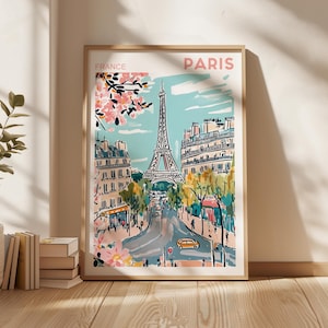 May include: A colorful illustration of the Eiffel Tower in Paris, France. The image features a blue sky with white clouds, pink cherry blossoms, and a street scene with cars and people. The text "FRANCE" and "PARIS" is printed on the poster.