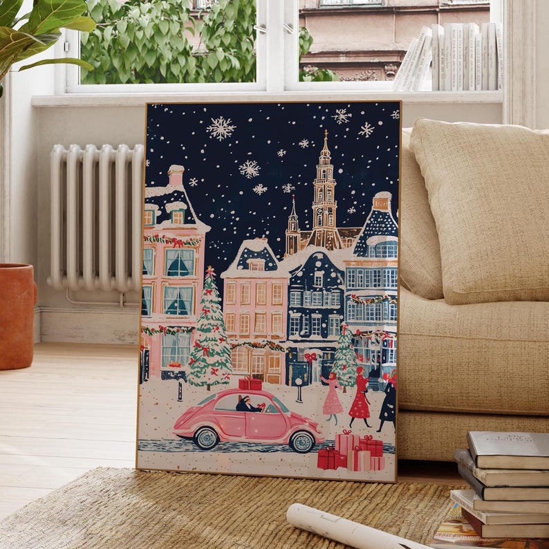 May include: A pink car drives through a snowy European town at night. The car is decorated with a Christmas tree and presents. The town is lit up with Christmas lights and there are people walking around.