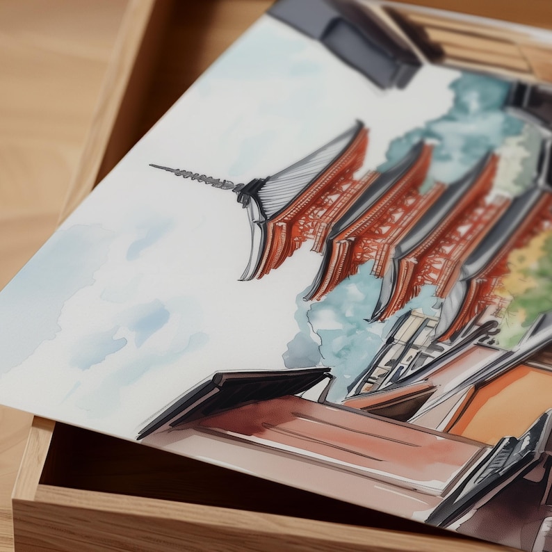 May include: Watercolor painting of a Japanese pagoda with red and gray roofs, set against a blue sky and green foliage. The artwork is displayed in a wooden box, showcasing the architectural details.