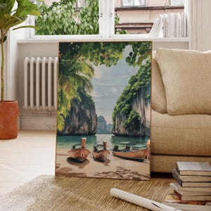 May include: A painting of a tropical scene with three longtail boats on a beach. The boats are brown and have a long tail that extends out behind them. The beach is white sand and the water is blue. There are green cliffs on either side of the beach.