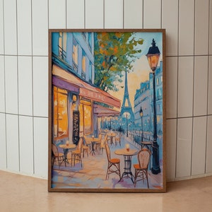 May include: A painting of a Parisian cafe with tables and chairs set up outside. The Eiffel Tower is visible in the background, and a street lamp stands tall on the right side of the painting. The cafe is painted in a warm, inviting style, with a yellow awning and a bright blue sky.