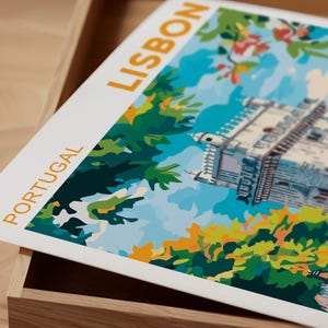 May include: A white card with the words "PORTUGAL" and "LISBON" printed in yellow. The card features a colorful illustration of a building with a blue sky and green trees.