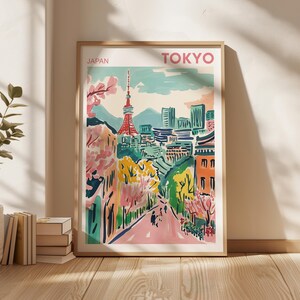 May include: A colorful illustration of Tokyo, Japan, with a tall tower in the center and a street lined with trees. The text "TOKYO" is at the top of the image and "JAPAN" is at the top left.