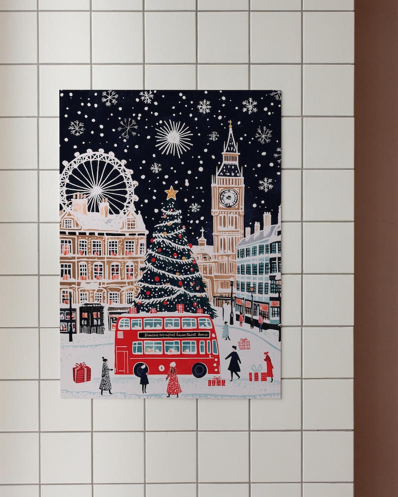May include: A festive illustration of a snowy London scene with Big Ben, a Ferris wheel, a Christmas tree, and a red double-decker bus. The text on the bus reads "London Transport Route Master Bus".
