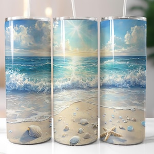 May include: Three stainless steel tumblers with a beach scene design. The tumblers feature a blue ocean with white waves crashing on a sandy beach. The scene includes seashells and a starfish.