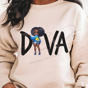 May include: A beige sweatshirt with the word "DIVA" in large black letters. The "I" is replaced by an illustration of a girl in a blue jacket and denim shorts. The words "DIGITAL DESIGNS" are below the word "DIVA".