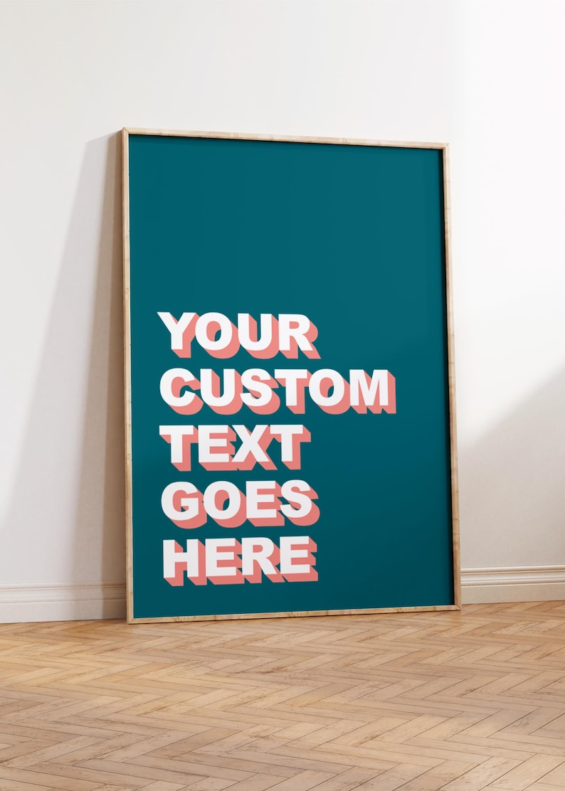 May include: A teal framed poster with white text that reads "YOUR CUSTOM TEXT GOES HERE" in a 3D style with pink outlines.