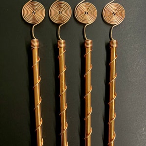 Four copper spiral antennas displayed together for indoor and outdoor gardens