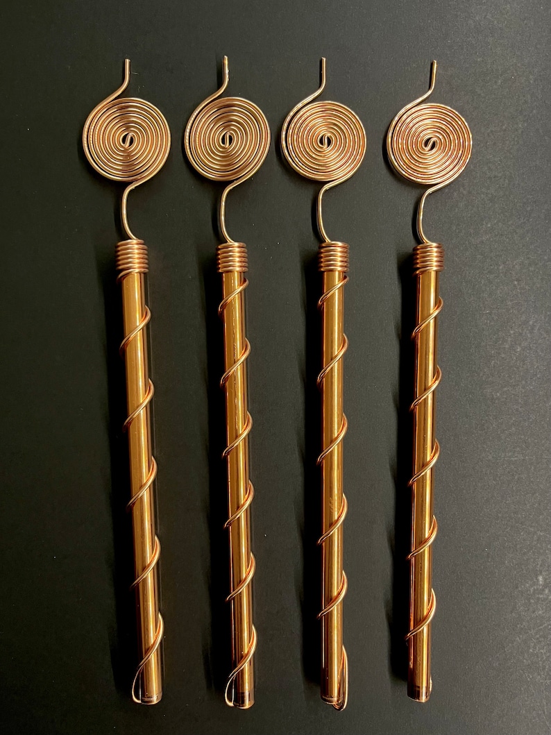 Four copper spiral antennas displayed together for indoor and outdoor gardens