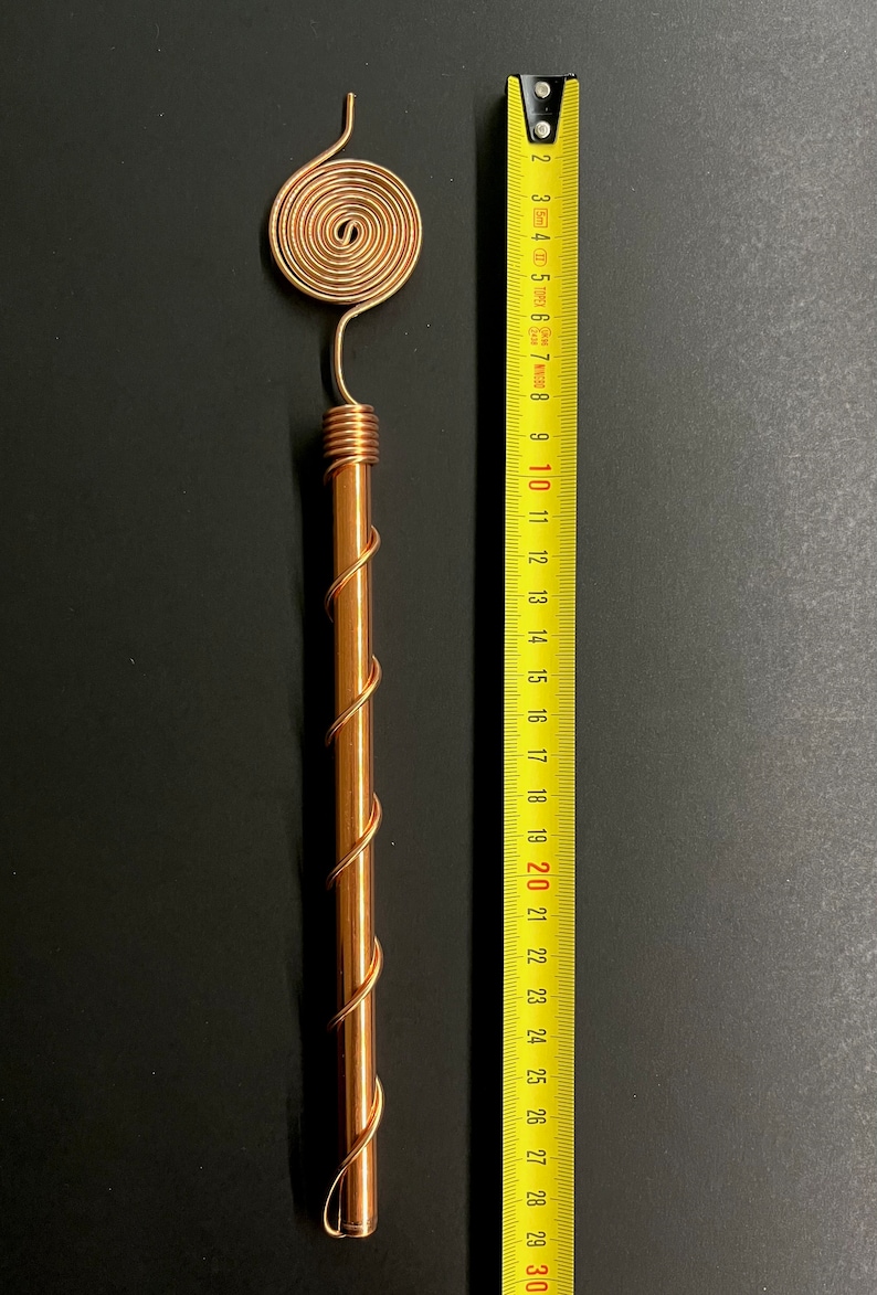 Copper antenna beside ruler showing 33 cm size for installation reference