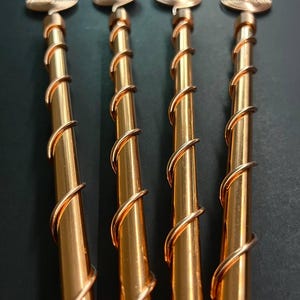 Close-up of twisted copper spirals demonstrating energy flow pattern