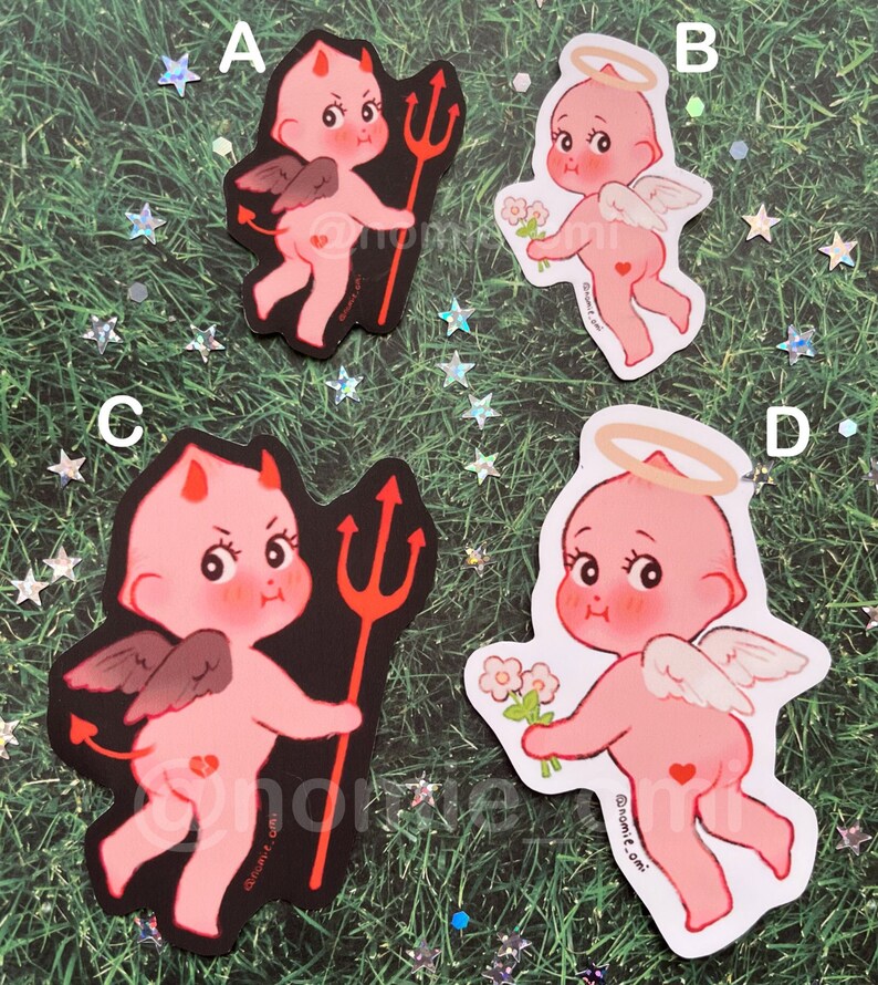 May include: Four stickers featuring a pink cherub with wings. Two stickers depict the cherub as a devil with a red trident and horns. The other two stickers depict the cherub as an angel with a halo and flowers. The stickers have a black background and a white background.