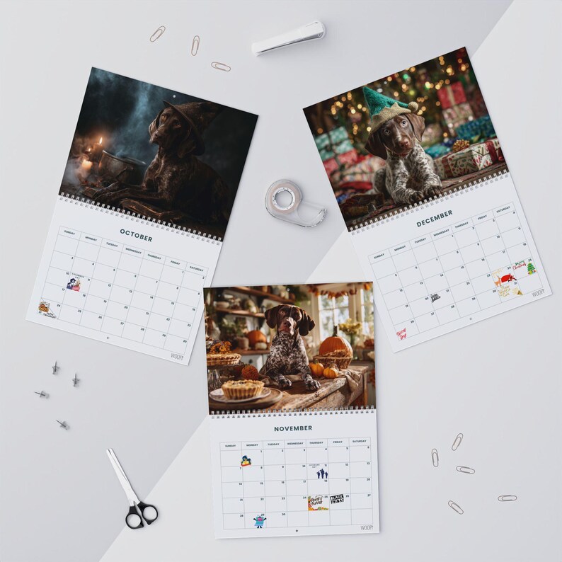 May include: Three wall calendar pages for October, November, and December featuring photographs of a brown and white spotted dog. The October page shows the dog in a witch hat, November shows the dog with pumpkins, and December shows the dog in an elf hat.