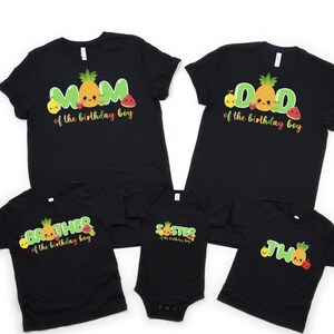 May include: Black t-shirts with fruit graphics and text that says "Mom of the birthday boy", "Dad of the birthday boy", "Brother of the birthday boy", "Sister of the birthday boy", and "Two of the birthday boy".