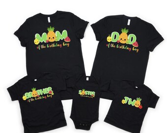 May include: Black t-shirts with fruit graphics and text that says "Mom of the birthday boy", "Dad of the birthday boy", "Brother of the birthday boy", "Sister of the birthday boy", and "Two of the birthday boy".