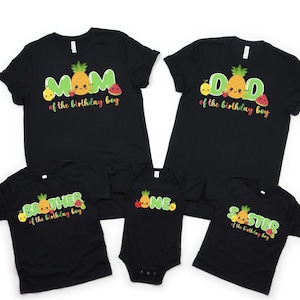 May include: Black t-shirts with fruit designs and text that says "Mom of the birthday boy", "Dad of the birthday boy", "Brother of the birthday boy", "One" and "Sister of the birthday boy".