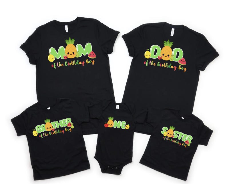 May include: Black t-shirts with fruit designs and text that says "Mom of the birthday boy", "Dad of the birthday boy", "Brother of the birthday boy", "One" and "Sister of the birthday boy".