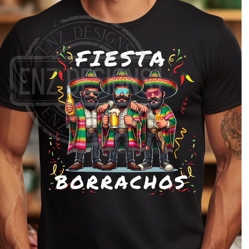 May include: Black t-shirt featuring a graphic of three men in sombreros, holding drinks. The text "Fiesta Borrachos" is displayed above and below the image. The men are wearing colorful serape jackets.