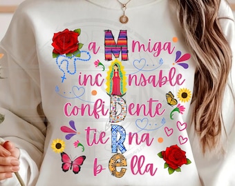May include: White sweatshirt with a colorful graphic design featuring the word "MIGA" with a religious figure in the center. The graphic also includes the words "INSANABLE", "CONFIDENTE", "TIERNA", and "BELLA".