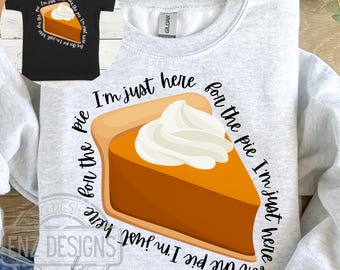 May include: A gray sweatshirt with the text "I'm just here for the pie I'm just here for the pie I'm just here" and a slice of pumpkin pie with whipped cream.