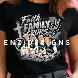 May include: Black t-shirt featuring a graphic design with the words "Faith Family Spurs" and the phrase "Go Spurs Go." The design includes a cross, a basketball team logo, and illustrations of four women in basketball jerseys.