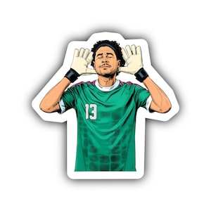 May include: A die-cut sticker featuring a cartoon illustration of a soccer goalkeeper with curly hair and a headband. The figure wears a green jersey with the number 13, black wristbands, and cream-colored goalkeeper gloves held near the ears.