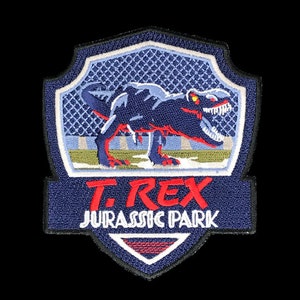 Puede incluir: Parche bordado azul y rojo con un dinosaurio T. Rex y el texto "T. Rex Jurassic Park".