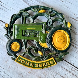 May include: A set of three ceramic mugs with a speckled, matte finish. The mugs are in shades of cream, light gray, and dark gray. Each mug has a simple, minimalist design, perfect for coffee or tea.