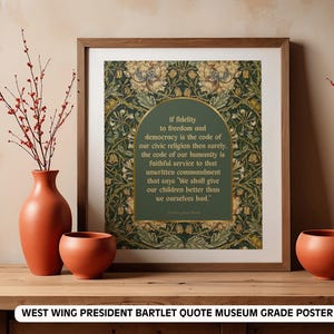 May include: A framed museum-grade poster featuring a quote by President Bartlet from The West Wing. The quote is set against a green and gold floral background. The frame is a warm brown, and the poster is displayed with terracotta vases and branches.