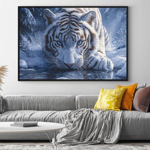 May include: A white tiger with blue eyes stares intensely at the viewer from a snowy forest setting. The tiger is lying in a pool of water, with its reflection visible in the water.